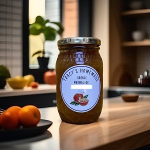4d2e6e82b4fc40a1bf3b93b468226df1~tplv-tnf8g33v4j-image A glass jar filled with thick orange marmalade. A label reads "Tracy's Homemade Orange Marmalade, South Africa