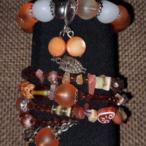 Brown Memory Wire Bracelet Set - Handcrafted by RSart in South Africa, featuring brown and white beads, silver caps, charms, rock beads, crystal beads, and painted heart-shaped beads.