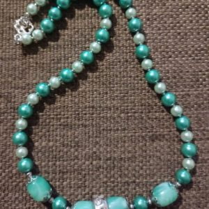 Arctic Blast Necklace Set - Handcrafted jewelry ensemble with green and white pearl beads, marble green glass beads, silver caps, and crystal-encrusted sliders by RSart in South Africa.