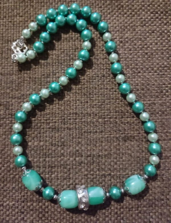 IMG-20240108-WA0052 Arctic Blast Necklace Set - Handcrafted jewelry ensemble with green and white pearl beads, marble green glass beads, silver caps, and crystal-encrusted sliders by RSart in South Africa.