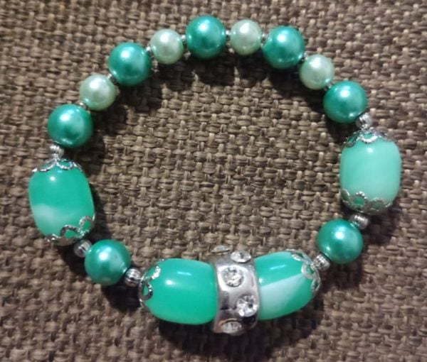 IMG-20240108-WA0053 Arctic Blast Necklace Set - Handcrafted jewelry ensemble with green and white pearl beads, marble green glass beads, silver caps, and crystal-encrusted sliders by RSart in South Africa.