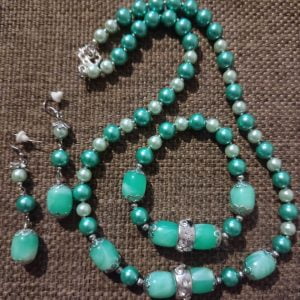 Arctic Blast Necklace Set - Handcrafted jewelry ensemble with green and white pearl beads, marble green glass beads, silver caps, and crystal-encrusted sliders by RSart in South Africa.
