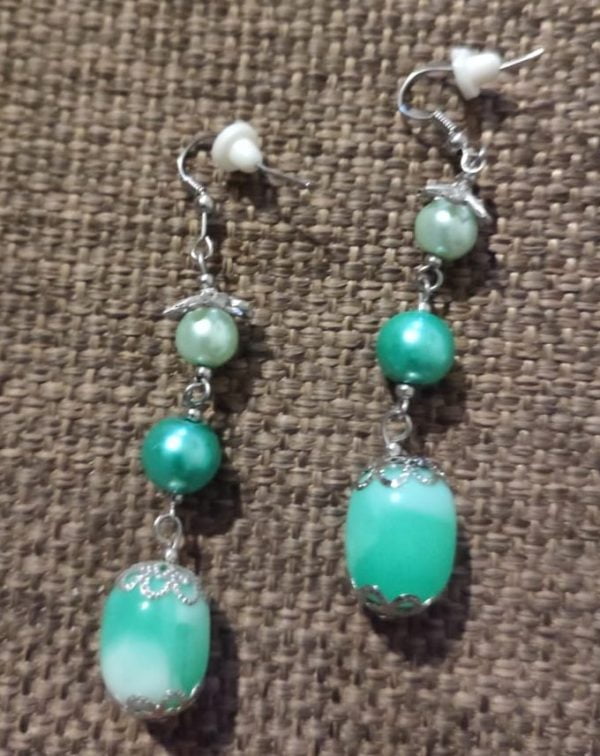 IMG-20240108-WA0057 Arctic Blast Necklace Set - Handcrafted jewelry ensemble with green and white pearl beads, marble green glass beads, silver caps, and crystal-encrusted sliders by RSart in South Africa.