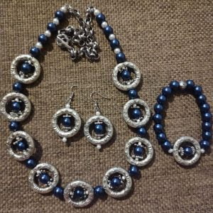 IMG-20240108-WA0068 Silver Loop Dark Royal Blue Necklace Set - Handcrafted jewelry ensemble with dark royal blue pearl beads, silver rings, sliders, and small white glass beads.