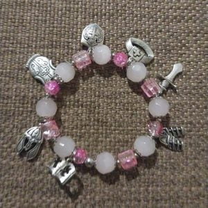 IMG-20240109-WA0051 Pink Armour of God Bracelet - Milky white and crystal pink beads with silver charms and sliders, elegant and meaningful jewelry piece.