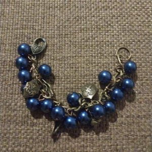 Bronze Armour of God Bracelet - Bronze chain with midnight blue beads and bronze charms, symbolic and elegant jewelry piece.