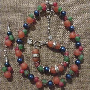 IMG-20240109-WA0070 Colorful Rainbow Rock Necklace Set with orange, green, and red rock beads, midnight blue glass beads, silver sliders, elasticated bracelet, and matching earrings by RSart in South Africa.