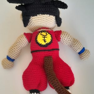 A 44cm tall crocheted figurine of the Dragon Ball Z character Goku standing in his iconic pose.