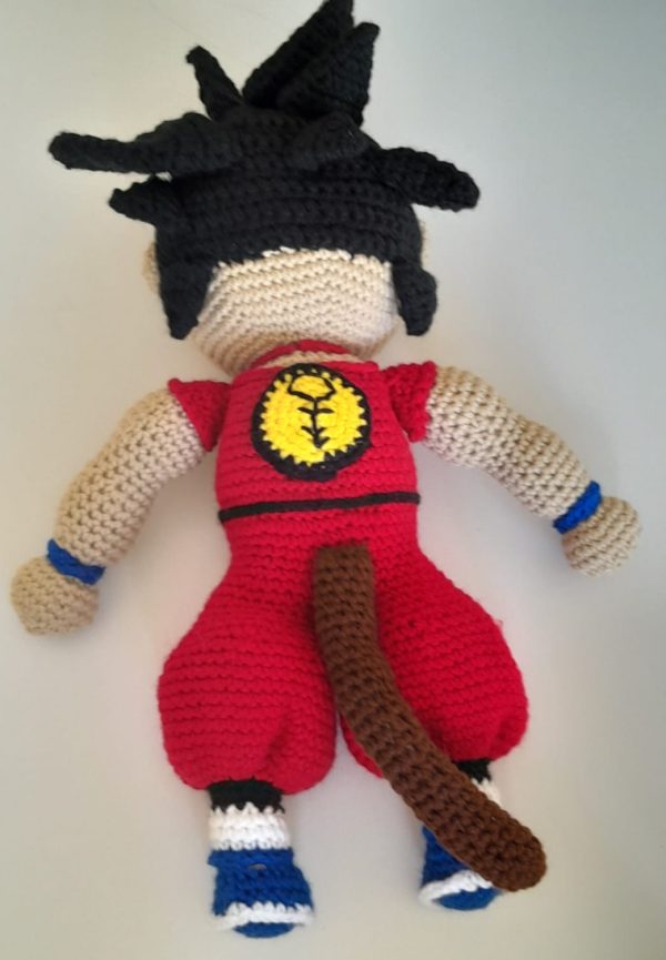 IMG_20231229_174451 A 44cm tall crocheted figurine of the Dragon Ball Z character Goku standing in his iconic pose.