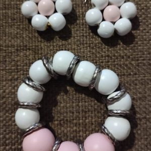 Soft Pink Wooden Bracelet Set Soft Pink Wooden Bracelet Set - Handcrafted jewelry featuring medium white and larger pink wooden beads with silver dividers, accompanied by matching floral earrings in pink and white beads.