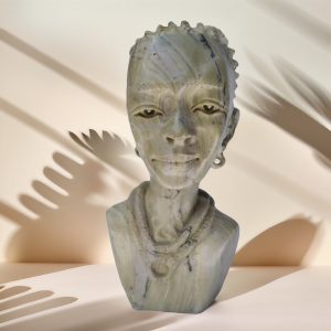 Stone African Woman Bust - Handcrafted sculpture depicting a traditional African woman, crafted by South African artists.