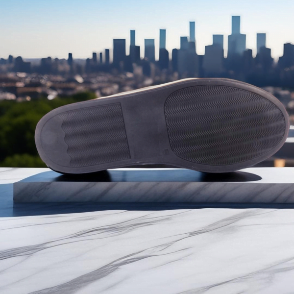 Page 1 Step into style and comfort with our Track Leather Sneaker, a premium unisex design handcrafted from genuine cowhide. Available in buffalo and calf leather