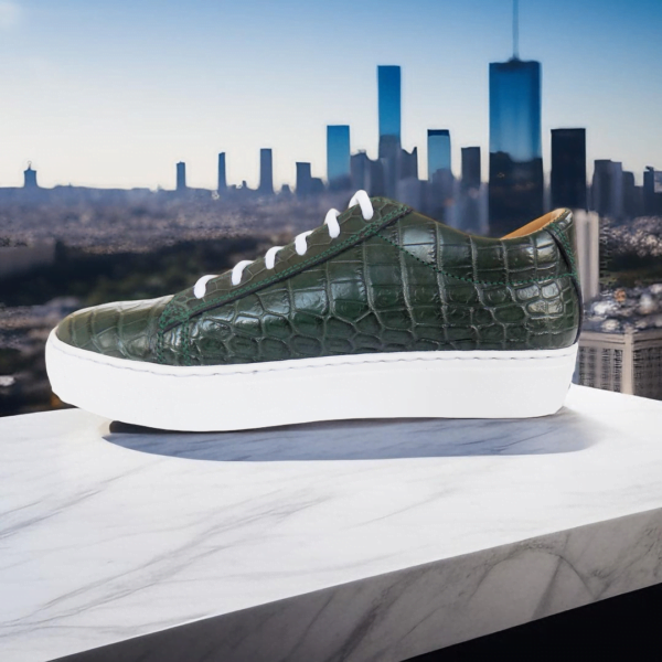 Page 4 Elevate your style with the Emerald Crocodile Sneaker, a handcrafted unisex footwear masterpiece featuring genuine crocodile leather, double-padded interiors, and a durable rubber sole. Available in a wide range of colors with white or black sole options.