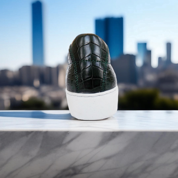Page 5 Elevate your style with the Emerald Crocodile Sneaker, a handcrafted unisex footwear masterpiece featuring genuine crocodile leather, double-padded interiors, and a durable rubber sole. Available in a wide range of colors with white or black sole options.