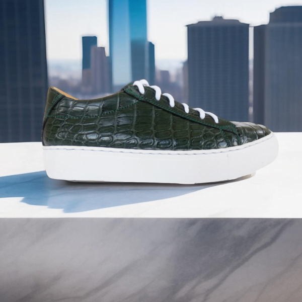 Page 6 Elevate your style with the Emerald Crocodile Sneaker, a handcrafted unisex footwear masterpiece featuring genuine crocodile leather, double-padded interiors, and a durable rubber sole. Available in a wide range of colors with white or black sole options.